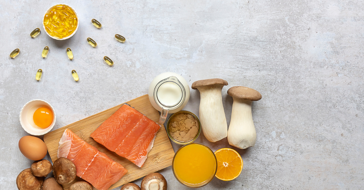 Flat lay composition with products rich in vitamin D. Canned tuna, mushrooms, salmon, eggs, milk, and orange juice - great natural sources of Vitamin D.
