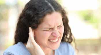 Woman complaining suffering ear ache