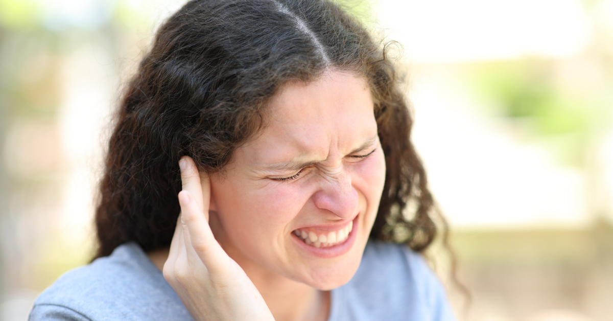 Woman complaining suffering ear ache