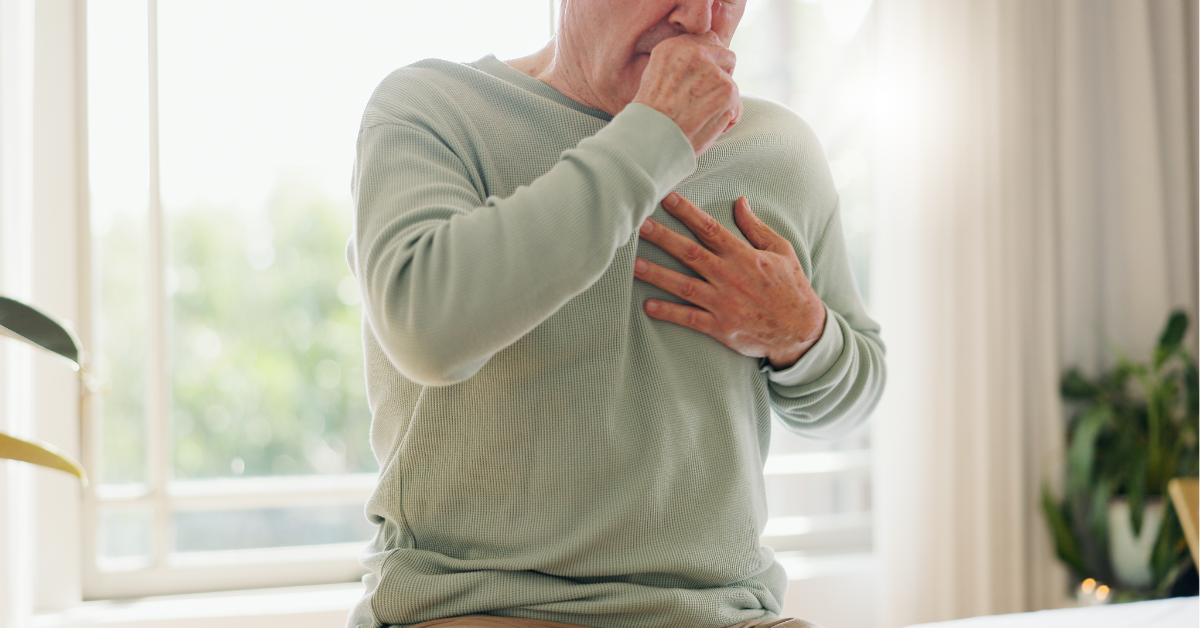 Coughing, sick and a person feeling chest for pain, heart attack or health problem at home.
