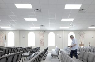 Reverend Benjy Simmons walking through church