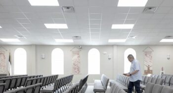 Reverend Benjy Simmons walking through church