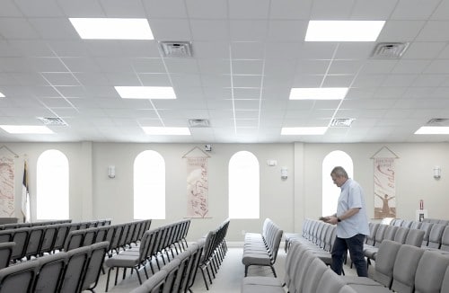 Reverend Benjy Simmons walking through church