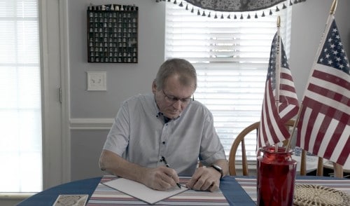 Simmons writing a letter