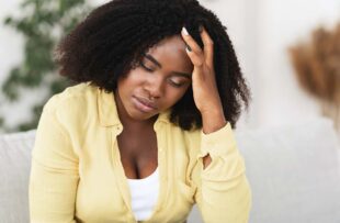 Woman struggling with an UTI.
