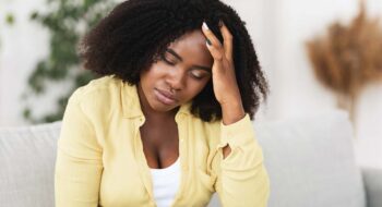 Woman struggling with an UTI.
